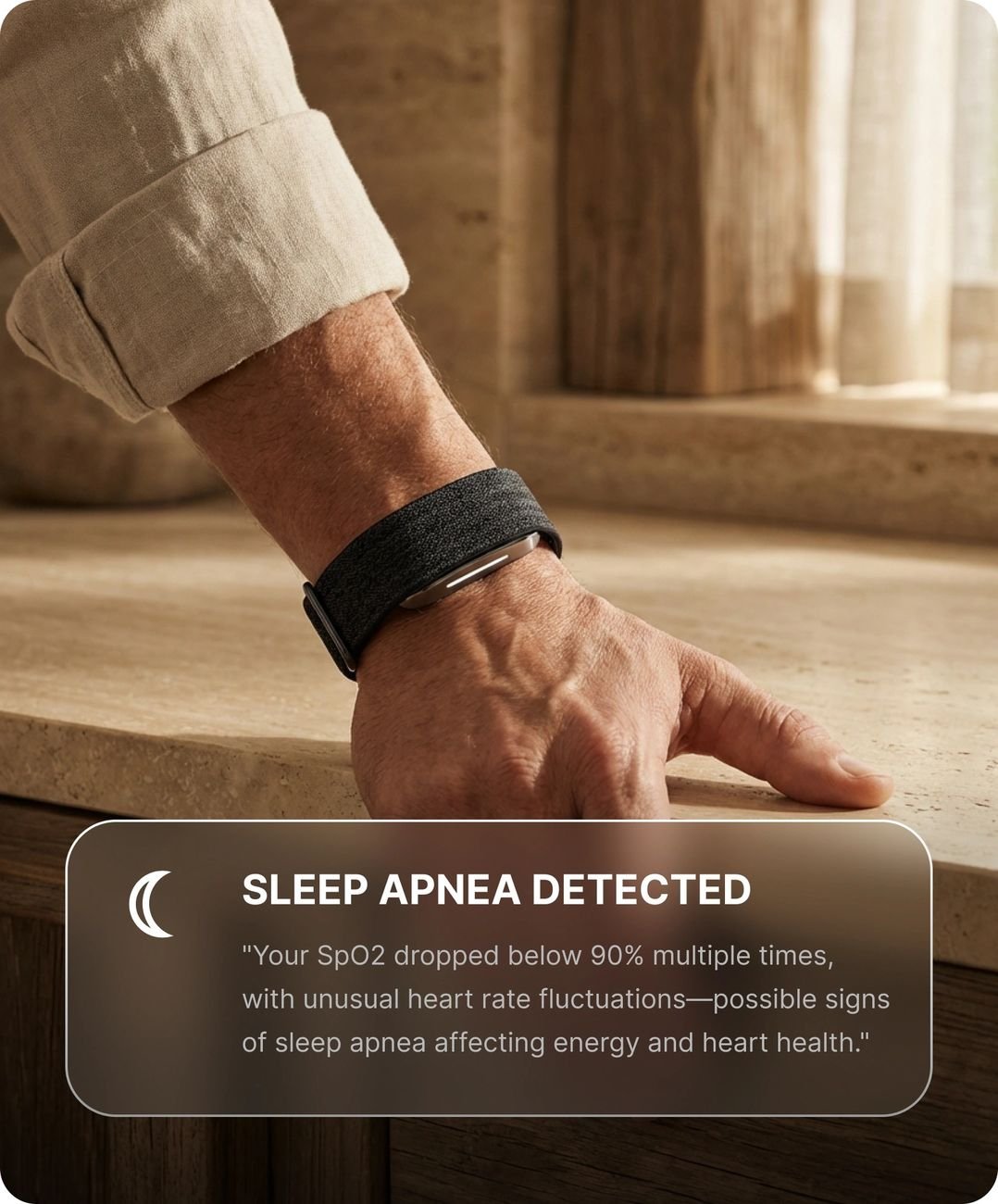 Human Band on wrist with a sleep apnea alert shown in the companion app